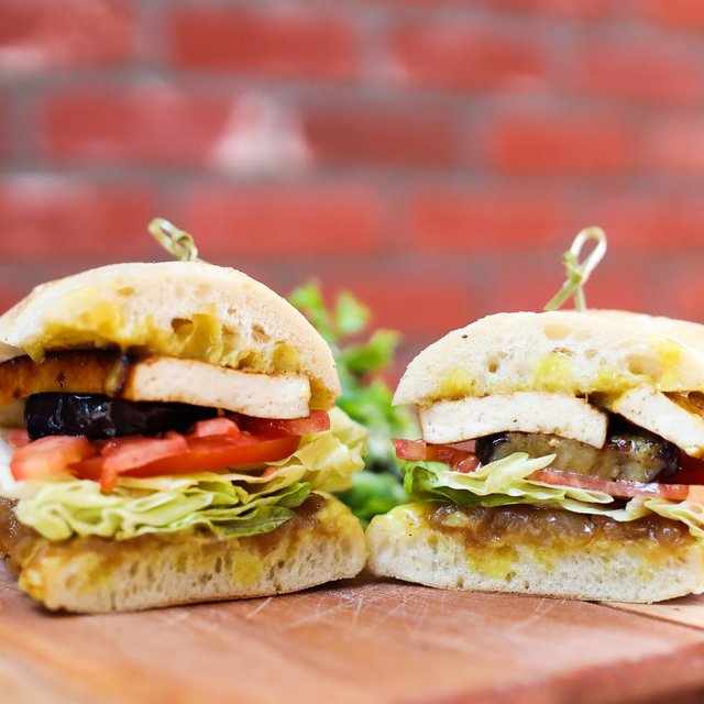 Our monthly special sandwich is scrumptious AND meatless: roasted tofu, confit onions, curry mayo, seasoned eggplant, tomato and lettuce ...